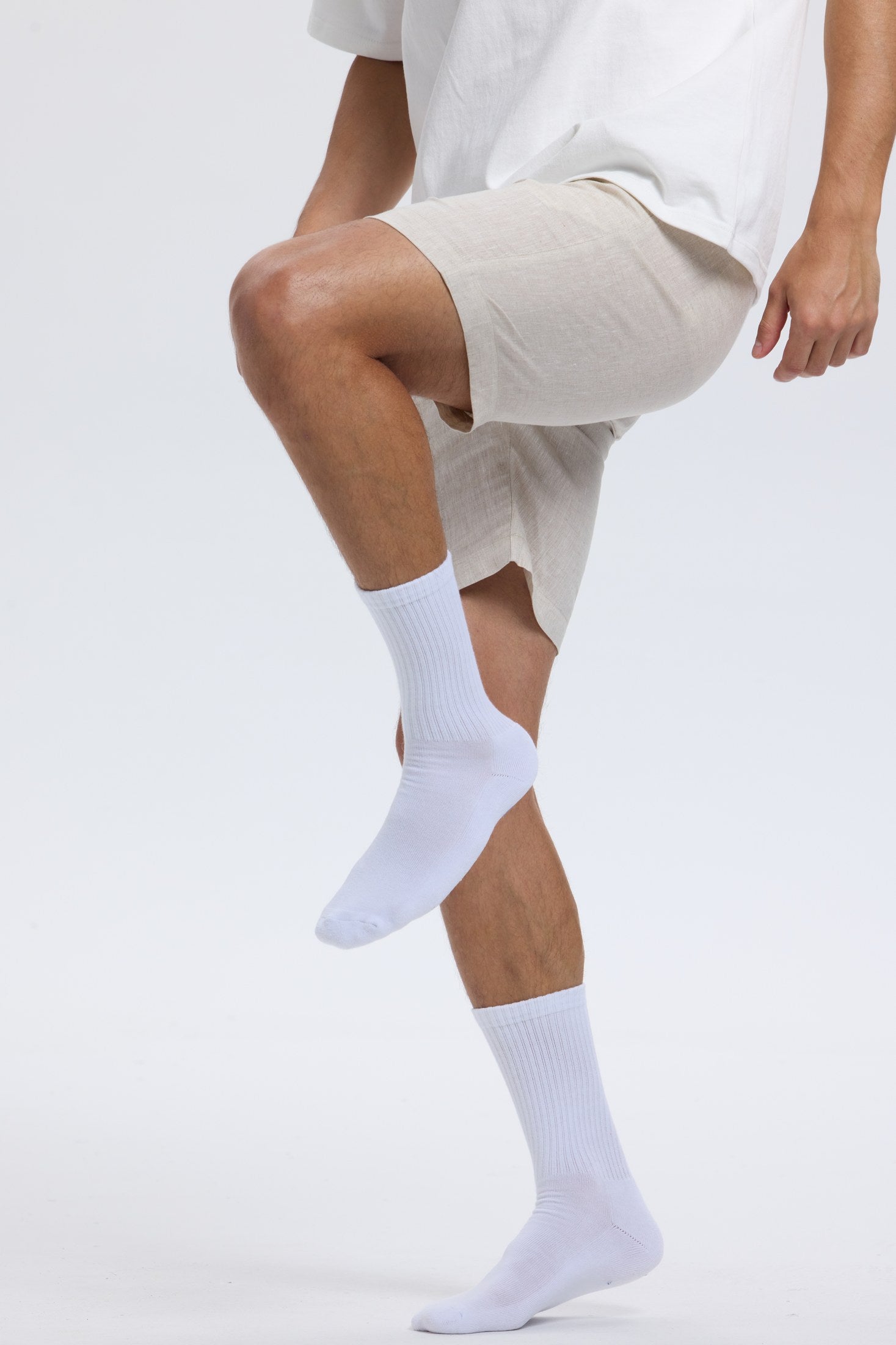 White Base Supply crew socks worn in motion