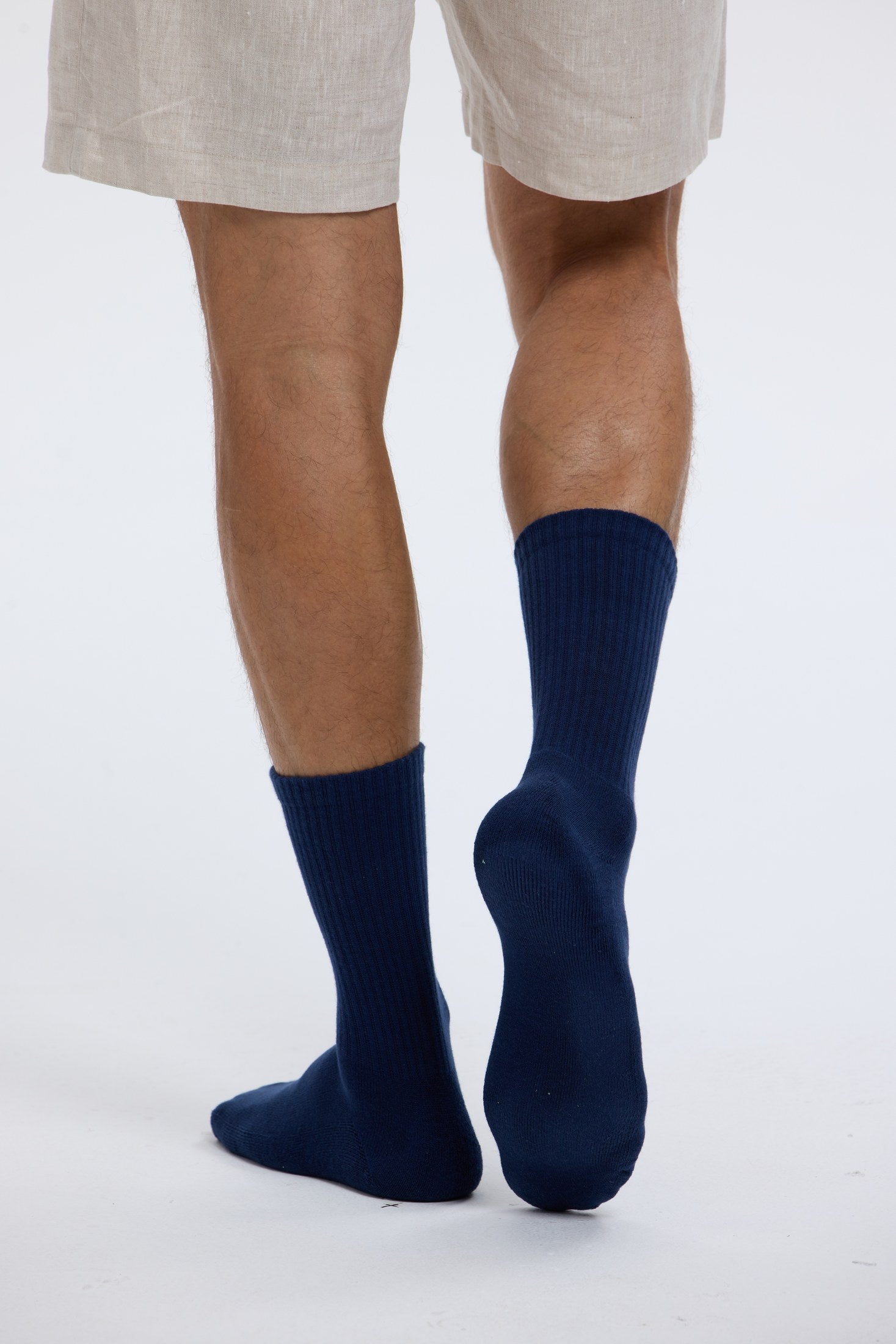 Close portrait of navy Base Supply crew socks being worn